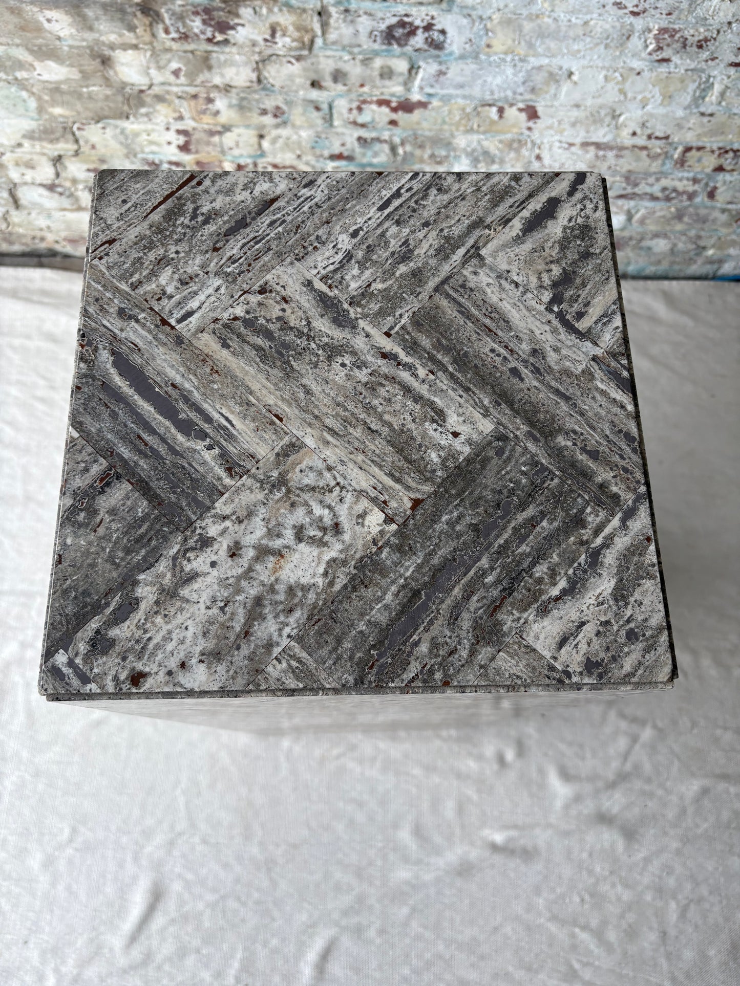 Gray Stone Herringbone Pedestal with Sculptural Geometric Inlay