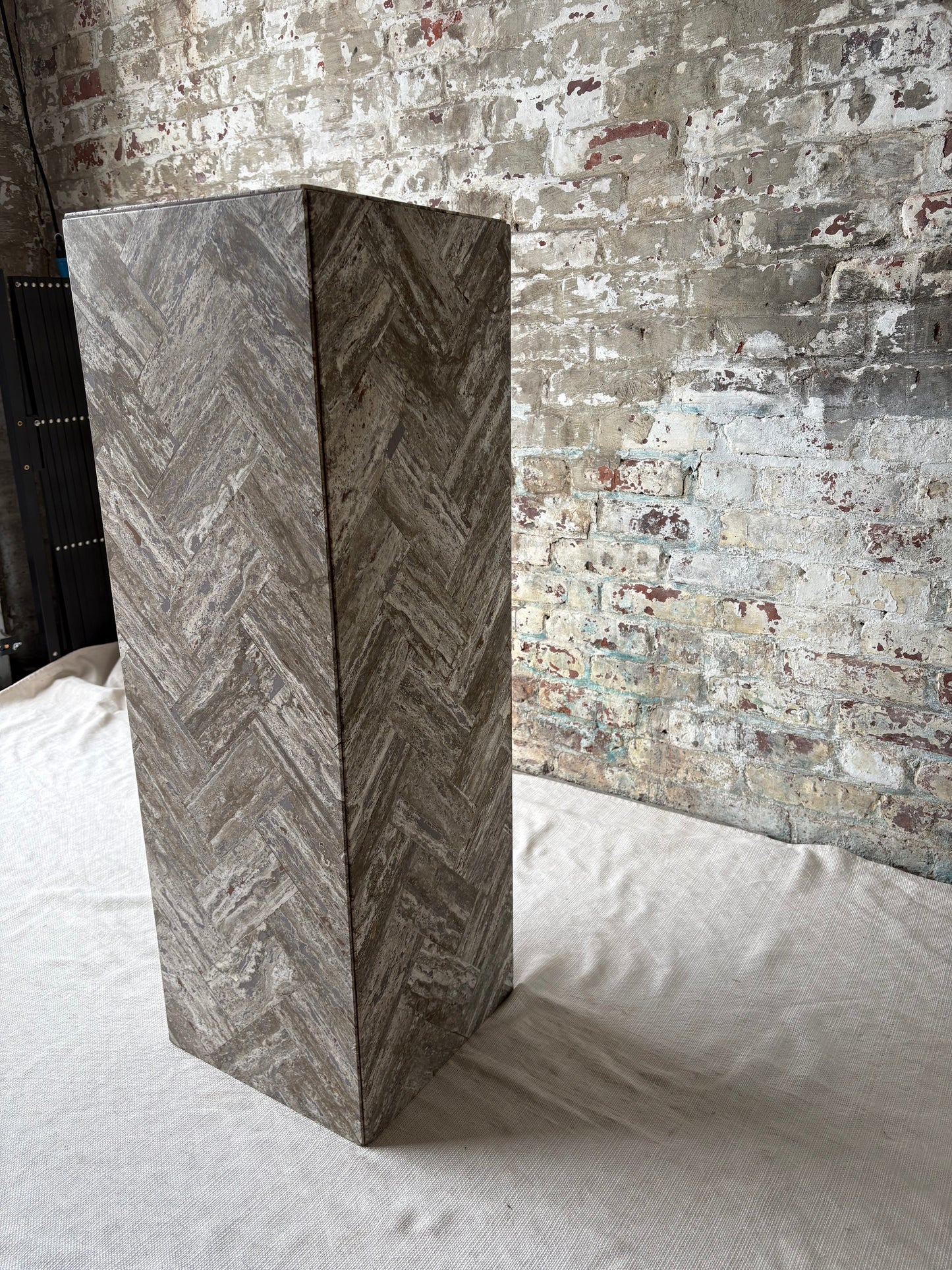 Gray Stone Herringbone Pedestal with Sculptural Geometric Inlay